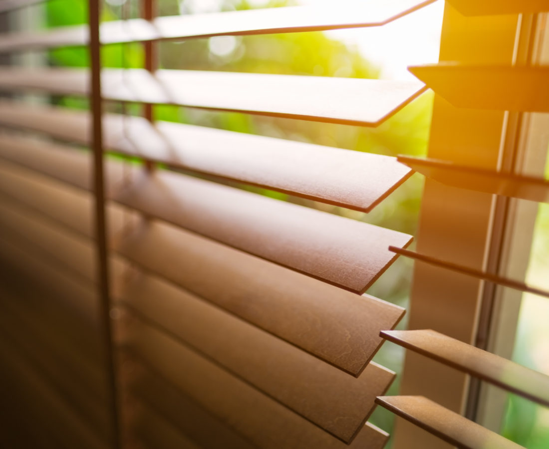 Wooden blinds with sun light.