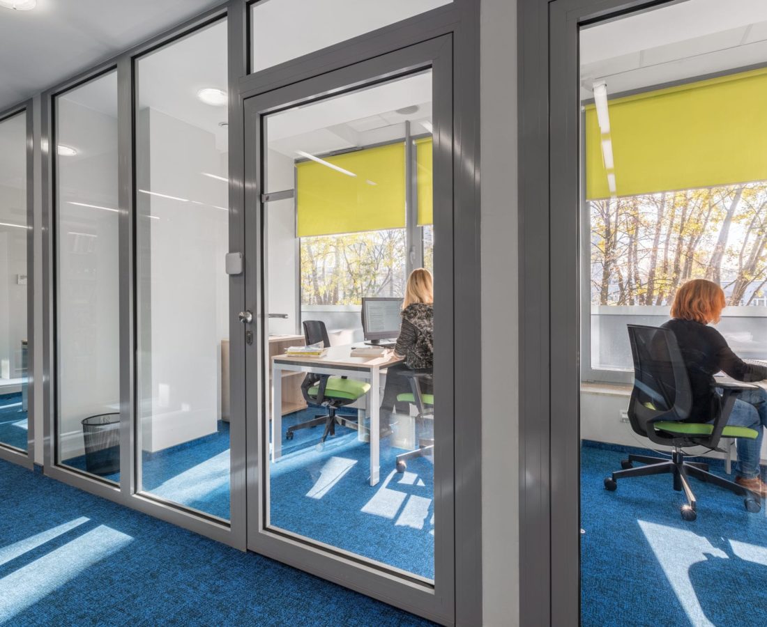 Modern and light office interior with glass wall